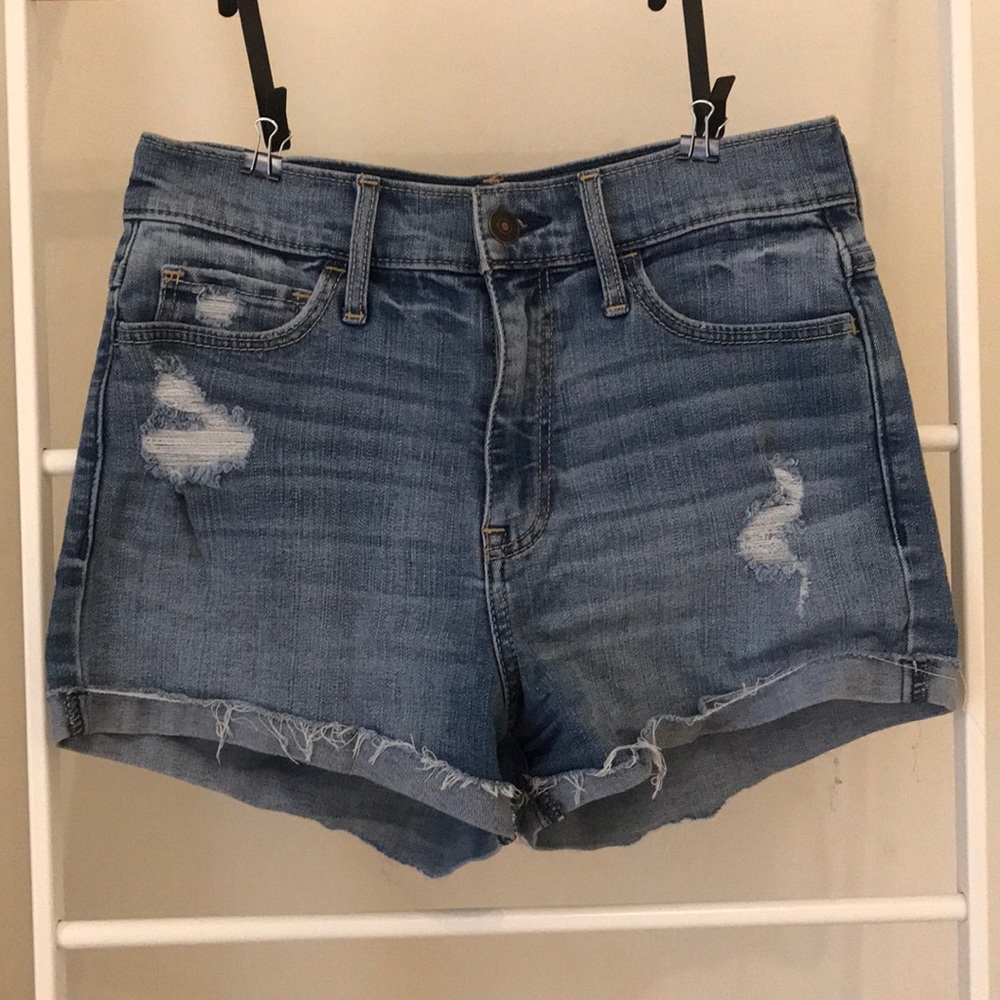 High waisted distressed blue jean shorts